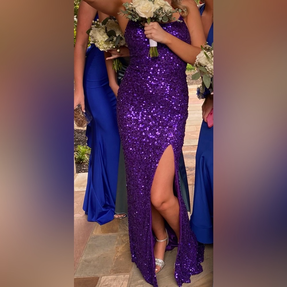 I am selling my prom dress! The color is dark purple with sparkles!